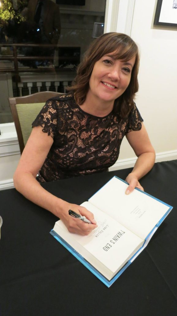 Lynn Cullen signs copies of Twain's End at the book's launch party.